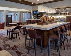 Dining area perfect for coworking at Sonesta Select Indianapolis Carmel.