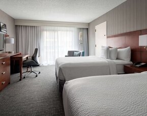 Bright and spacious day use twin room with work desk and floor to ceiling window at Sonesta Select Los Angeles LAX El Segundo.