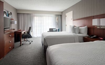 Bright and spacious day use twin room with work desk and floor to ceiling window at Sonesta Select Los Angeles LAX El Segundo.