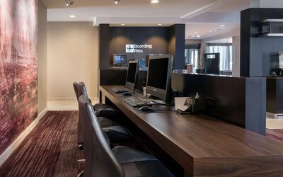 Business center with computers, printer and ergonomic chairs at Sonesta Select Los Angeles LAX El Segundo.