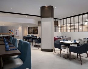 Dining area perfect for coworking at Hilton Crystal City At Washington Reagan National Airport.