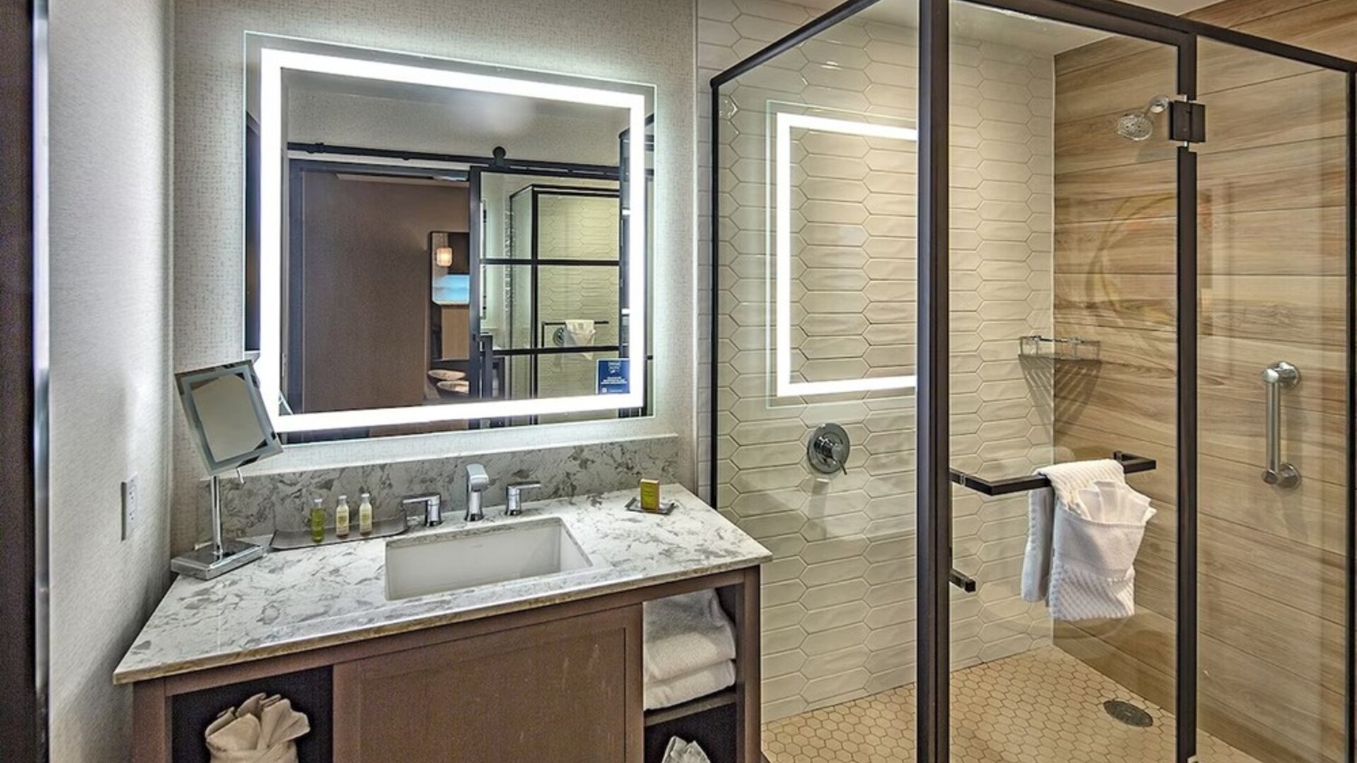 Guest bathroom with shower at DoubleTree By Hilton Modesto.