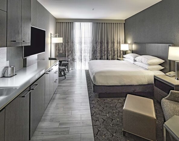 Day use room with mini kitchen and TV at DoubleTree By Hilton Modesto.