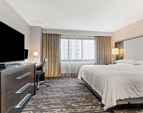 Day use room with natural light and work desk at Embassy Suites By Hilton Crystal City-National Airport.