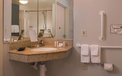 Private guest bathroom with shower and free toiletries at Sonesta Select Columbia.
