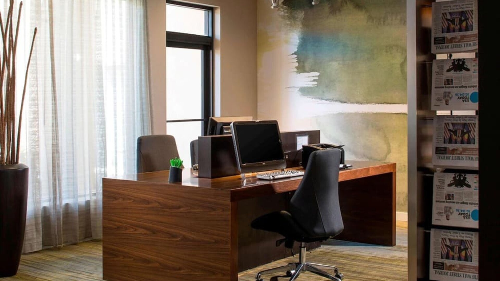 Business center with computers, printer and ergonomic chairs at Sonesta Select Boca Raton.