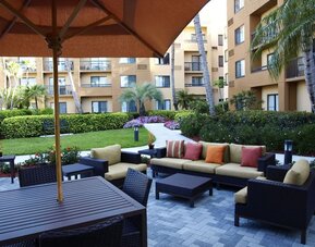Outdoor lounge seating area at Sonesta Select Boca Raton.