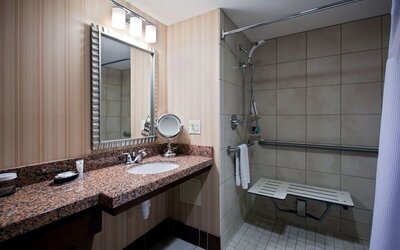 Private guest bathroom with shower at Sonesta Milwaukee West Wauwatosa.