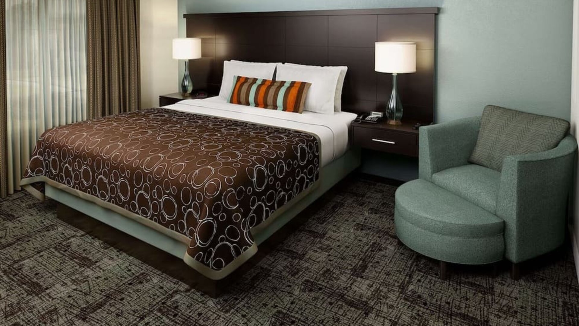 Bright and spacious day use room with sofa at Sonesta ES Suites Dallas Las Colinas.