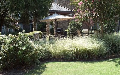 Patio with lounge seating at Sonesta ES Suites Dallas Las Colinas.
