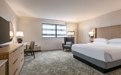 Spacious king size bed, TV and desk in a day use room at DoubleTree By Hilton Canton Downtown.