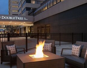 Firepit surrounded by seats at DoubleTree By Hilton Canton Downtown.
