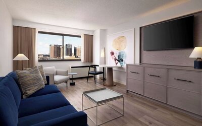 Room workspace with living area at Sonesta White Plains Downtown.