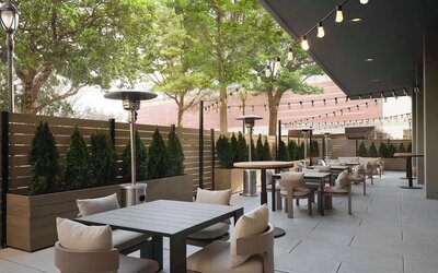 Hotel terrace with seating area, perfect for coworking at Sonesta White Plains Downtown.