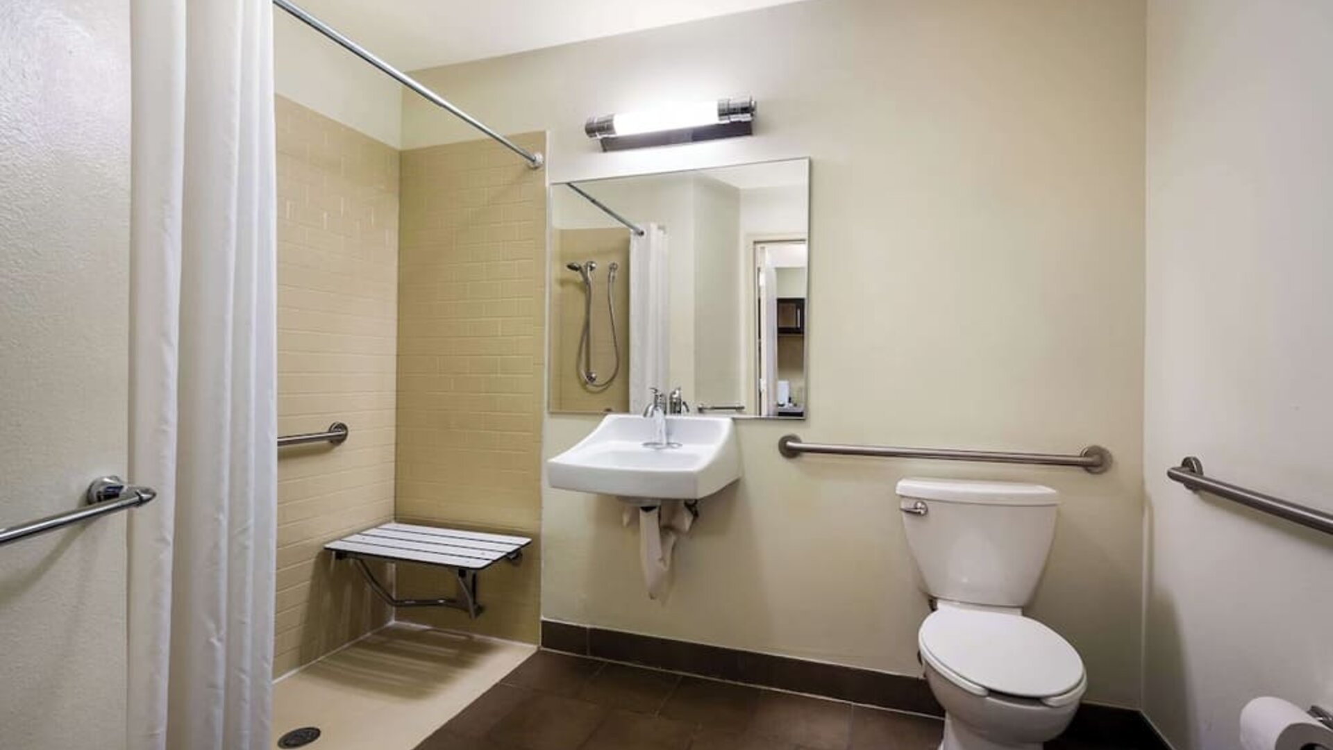 Accessible private guest bathroom with shower at Sonesta Simply Suites St Louis Earth City.