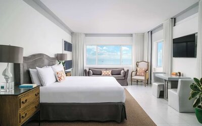 Bright and spacious day use room with workspace and lounge seating at Nautilus Sonesta Miami Beach.