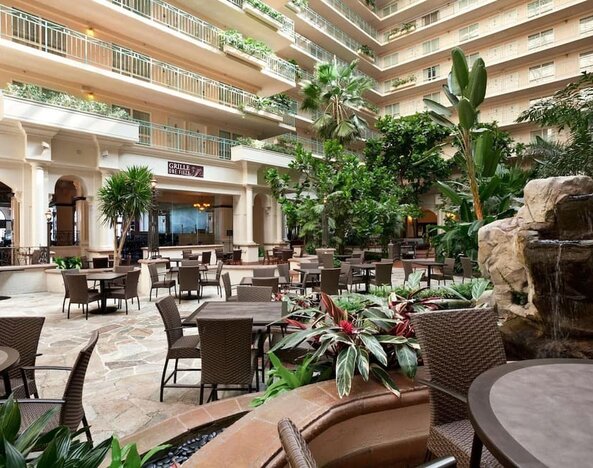 Breakfast area with natural light perfect for coworking at Embassy Suites By Hilton San Francisco Airport Waterfront.