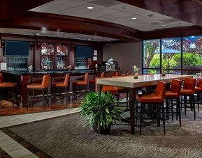 Hotel bar and lounge area at Sonesta Atlanta Airport North.