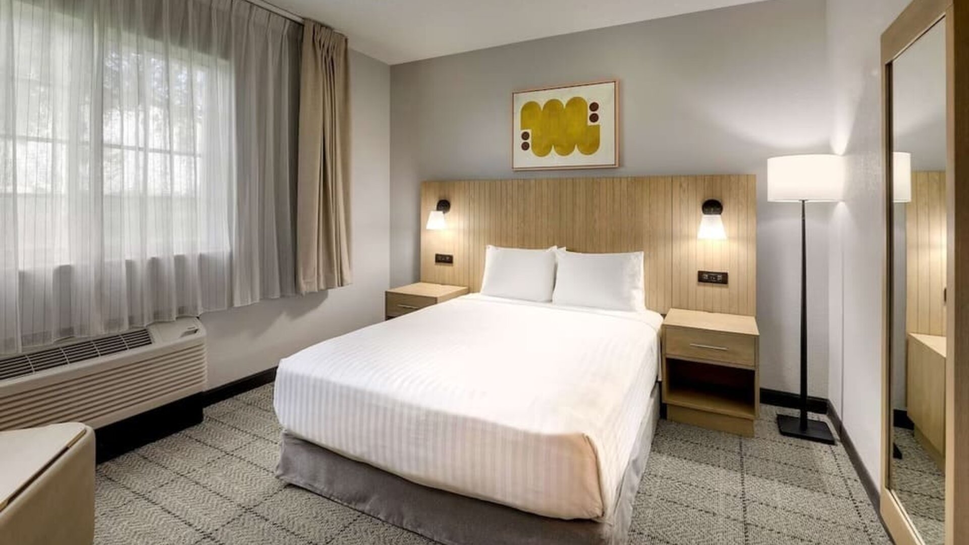 King bed at Sonesta Simply Suites Miami Airport Doral.