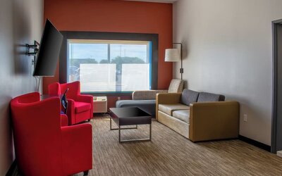 Suite with living room at Holiday Inn Express & Suites Yorkville.