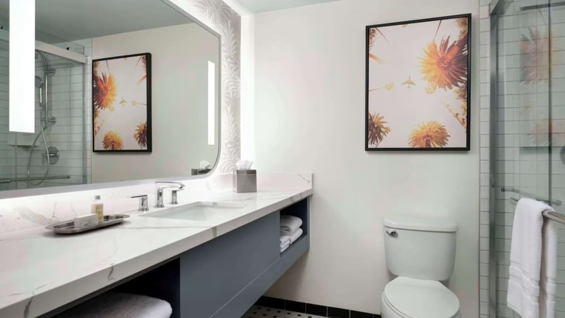 Private guest bathroom with shower and free toiletries at Sonesta Los Angeles Airport LAX.