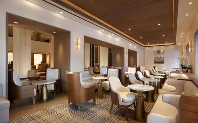 The hotel’s Living Room is furnished with comfortable seating and small tables, where guests can socialize, co-work, or have a drink.