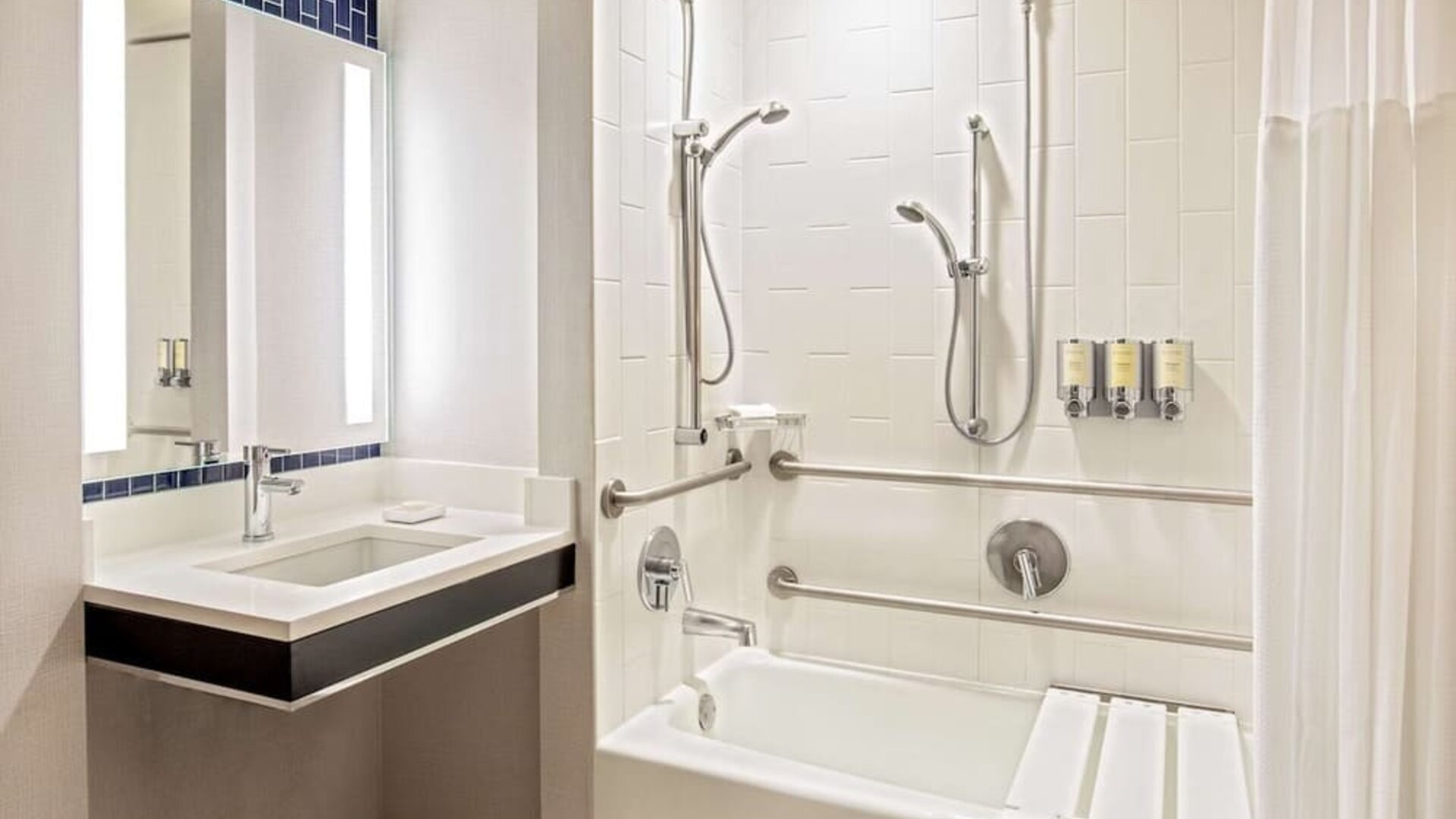 Private guest bathroom with combined shower and tub at Royal Sonesta Boston.