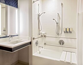 Private guest bathroom with combined shower and tub at Royal Sonesta Boston.
