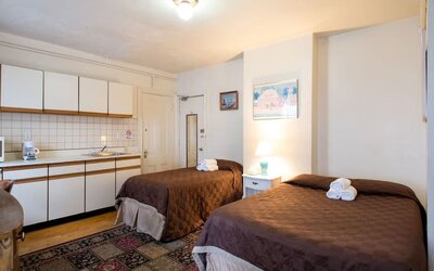 Day use twin room with in-room kitchen and work desk at The Farrington Inn.