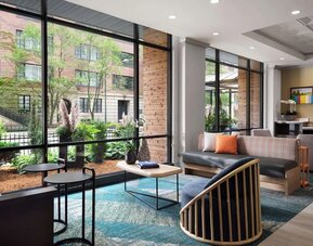 Lobby lounge and workspace, perfect for coworking at Sonesta ES Suites Chicago Downtown Magnificent Mile - Medical.