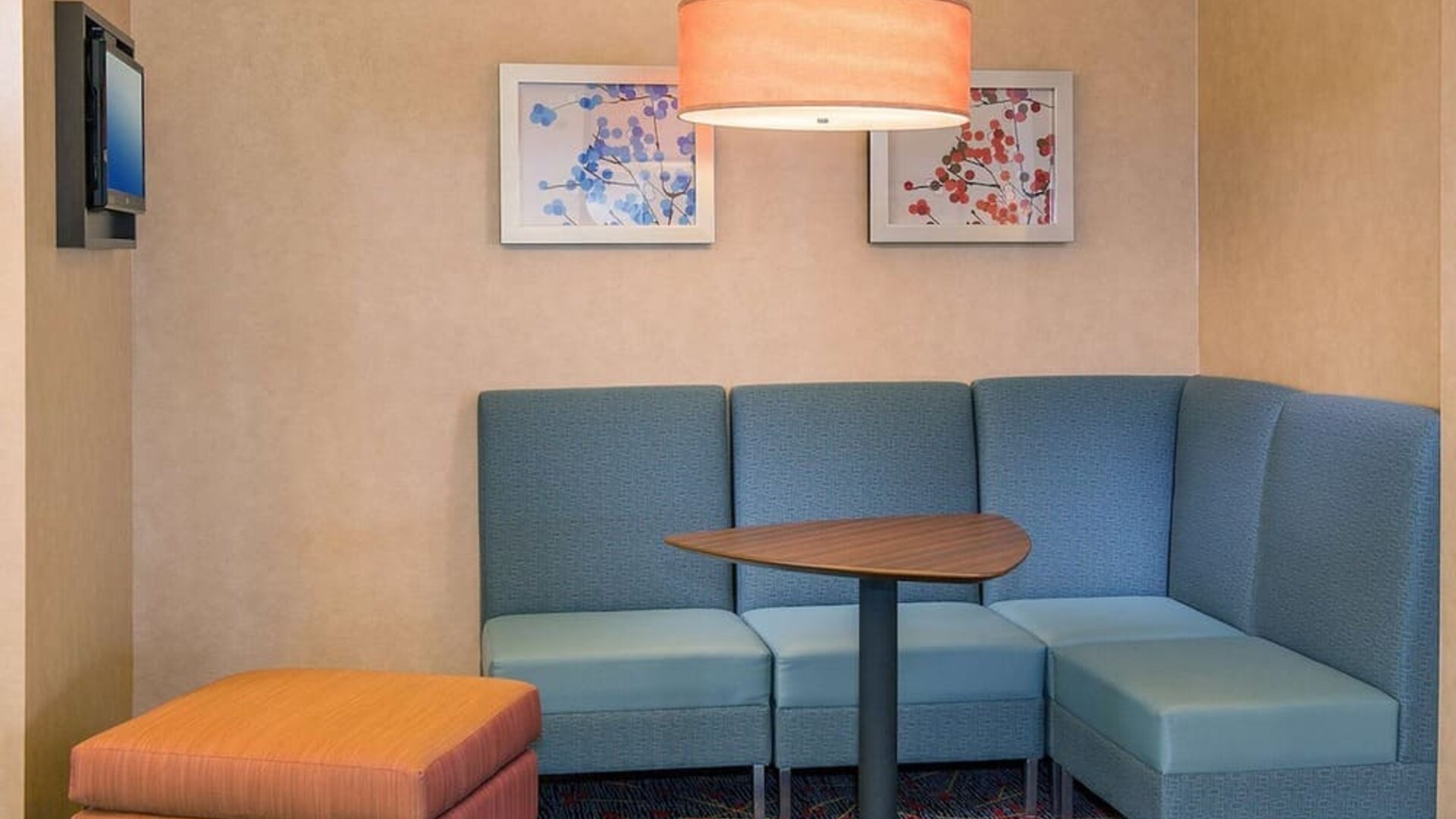 Lobby workspace with comfortable seating at Sonesta ES Suites Charlottesville University.