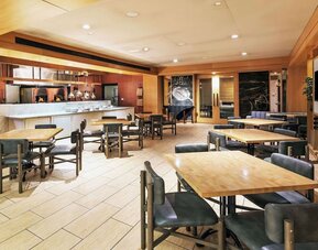 Dining area perfect for coworking at DoubleTree By Hilton Tulsa-Downtown.

