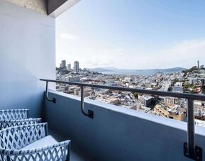 Balcony inside day use room overlooking the city at Hilton San Francisco Financial District.
