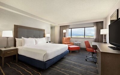Comfortable king room with work desk and lounger at DoubleTree By Hilton Albuquerque.