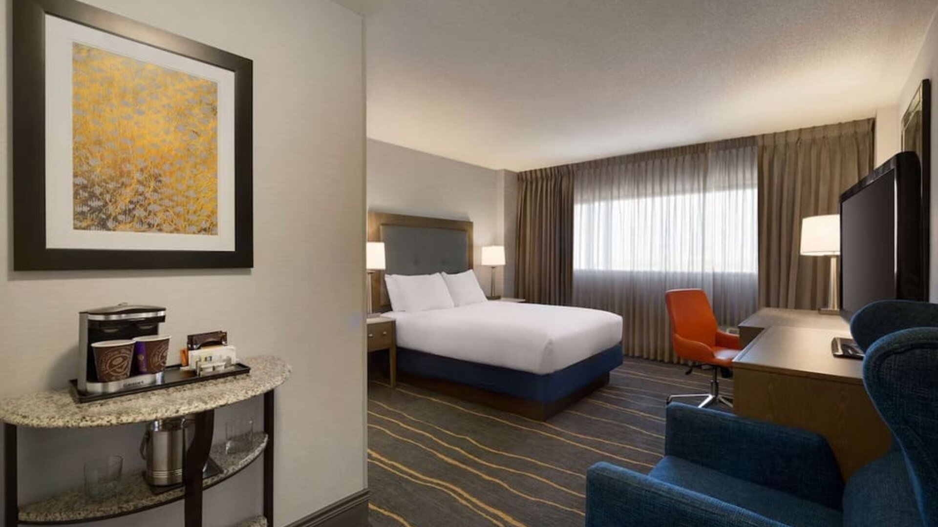 Day use room with work desk, lounger and coffee machine at DoubleTree By Hilton Albuquerque.