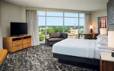 Spacious day use room with work desk overlooking the city at Embassy Suites By Hilton Hampton Convention Center.