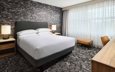 Day use room with work desk and natural light at Embassy Suites By Hilton Hampton Convention Center.