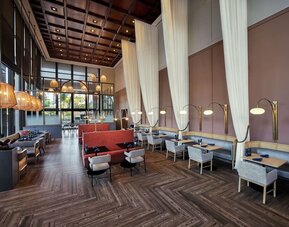 Breakfast area with natural light perfect for coworking at Hotel Fera Anaheim, A DoubleTree By Hilton.