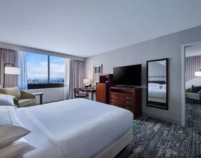 Day use room with work desk and living area at Hotel Fera Anaheim, A DoubleTree By Hilton.