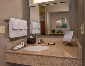 Private guest bathroom with free toiletries at Sonesta Select Arlington Rosslyn.