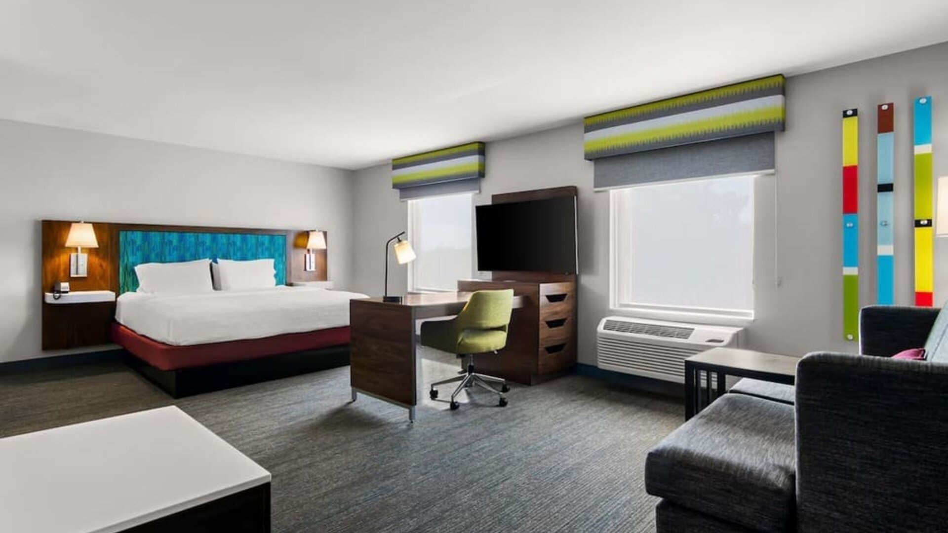 Spacious hotel suite with king size bed and working station at Hampton Inn & Suites Schererville.