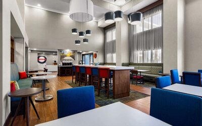 Lobby and coworking lounge at Hampton Inn & Suites Schererville.