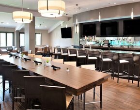 Bright-lit hotel bar at Embassy Suites By Hilton Seattle-North-Lynnwood.