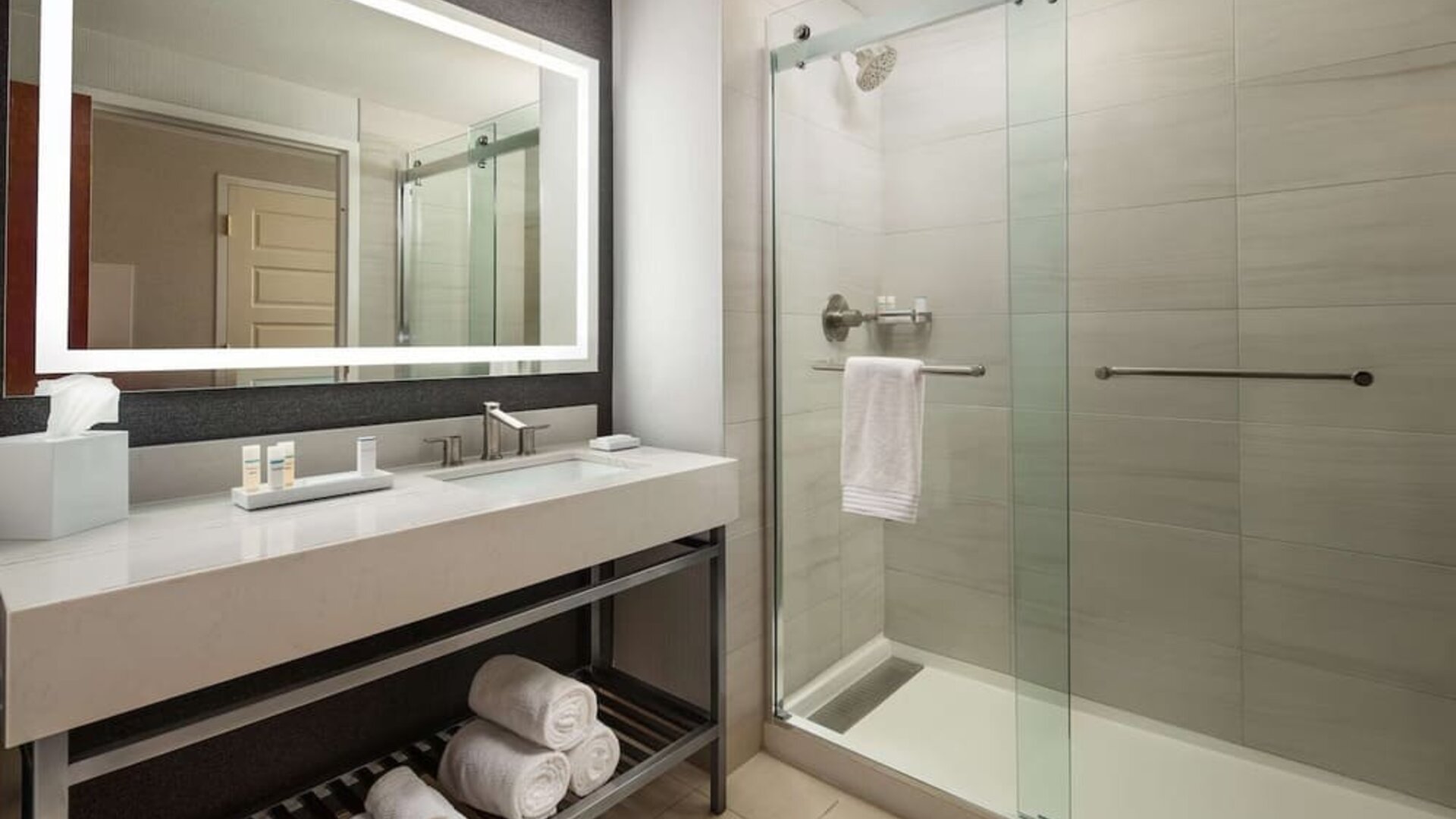 Guest bathroom with shower at Hilton Charlotte Airport.
