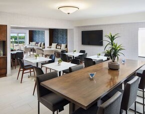 Executive lounge perfect for coworking at Hilton Charlotte Airport.
