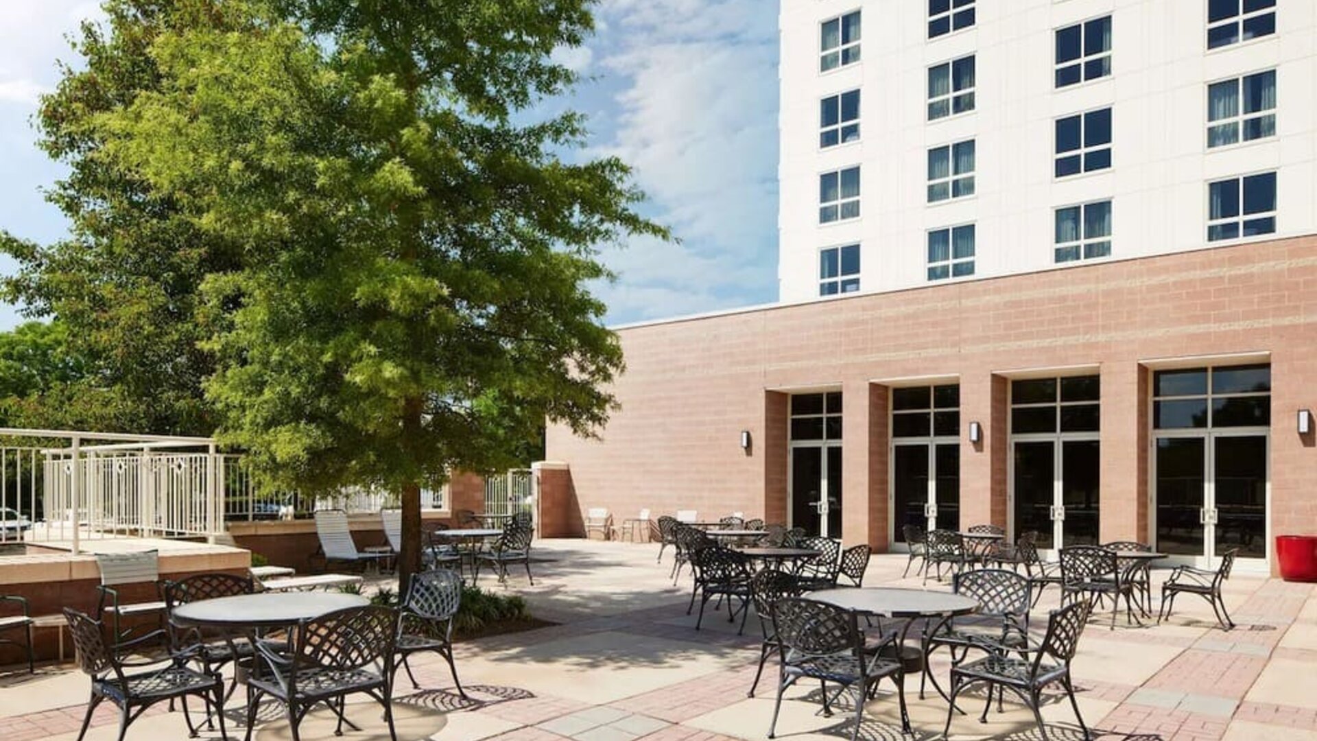 Outdoor seats available in the courtyard of the Hilton Charlotte Airport.
