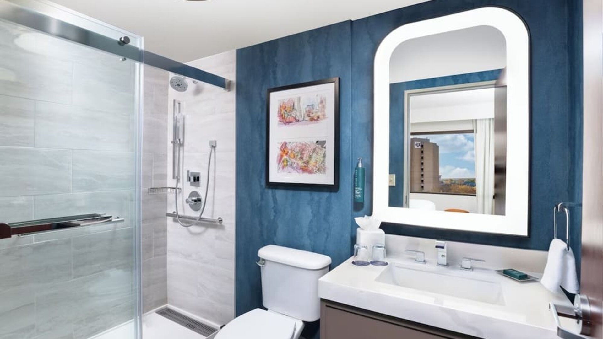 Guest bathroom with shower at Doubletree By Hilton Houston Medical Center Hotel & Suites.