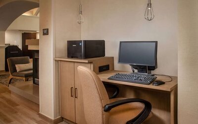 Business center with computer, printer and ergonomic chair at Sonesta ES Suites Baltimore BWI Airport.