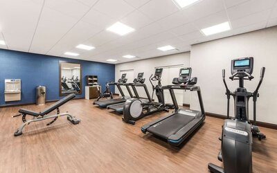 Fully equipped fitness center at Hampton Inn & Suites Benton Harbor.