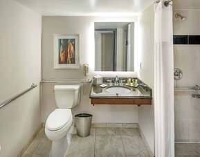 Private guest bathroom with shower and free toiletries at Hilton Minneapolis.